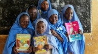 Schoolchildren holding books